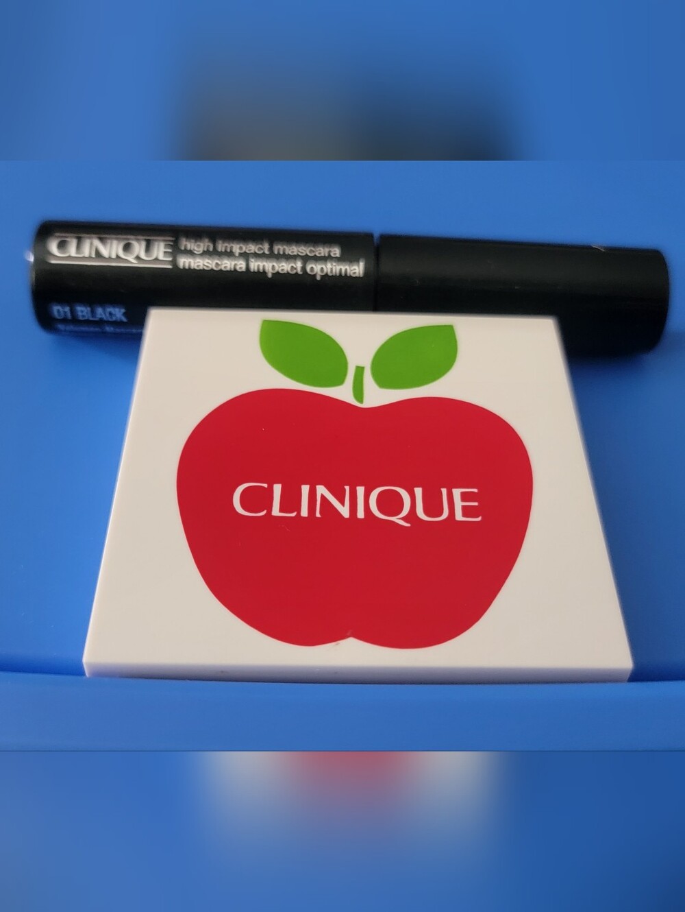Clinique Eyeshadow Palette with Red Apple Graphic and Green Leaves